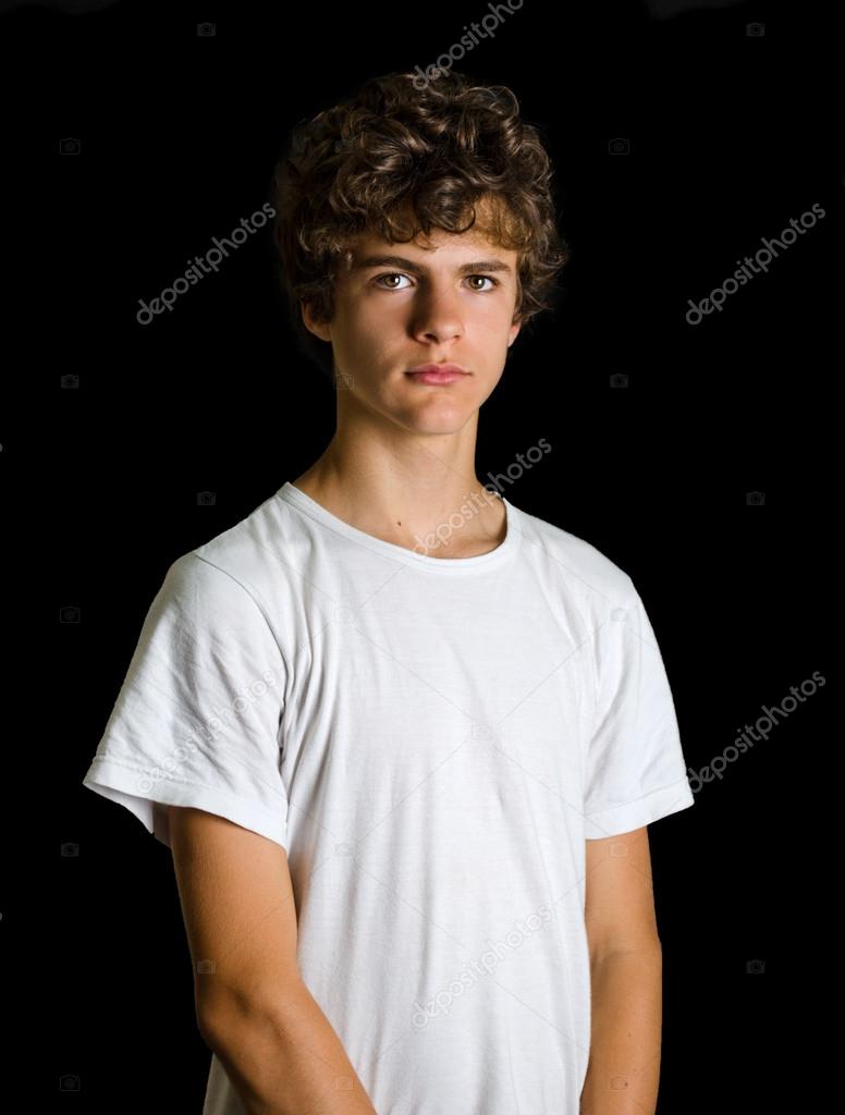 Cute curly haired teenage standing on black Stock Photo by ©StarsStudio  33364283