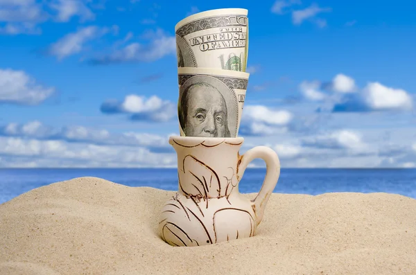Dollars on a beach — Stock Photo, Image