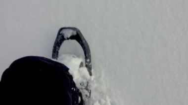 Hiker With Snowshoes Walking In Deep Snow