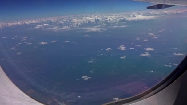 Aerial View Airplane Porthole Clouds — Vídeo de stock