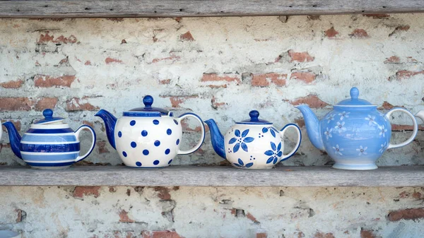 Beautiful Row Group Four Handcrafted Blue Ceramic Kettles Wooden Shelf — Stock Photo, Image