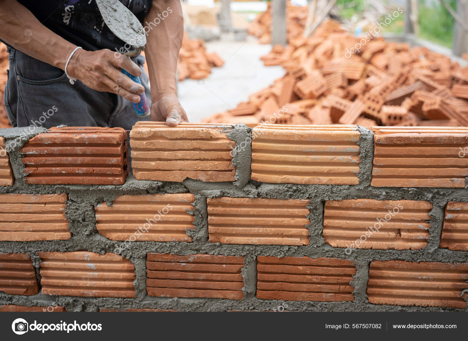 Construction Worker Installing Bricks Masonry Bricklayer Adjusting