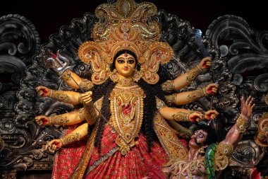 Goddess Durga devi idol decorated at puja pandal in Kolkata, West Bengal, India. Durga Puja is biggest religious festival of Hinduism and is now celebrated worldwide.