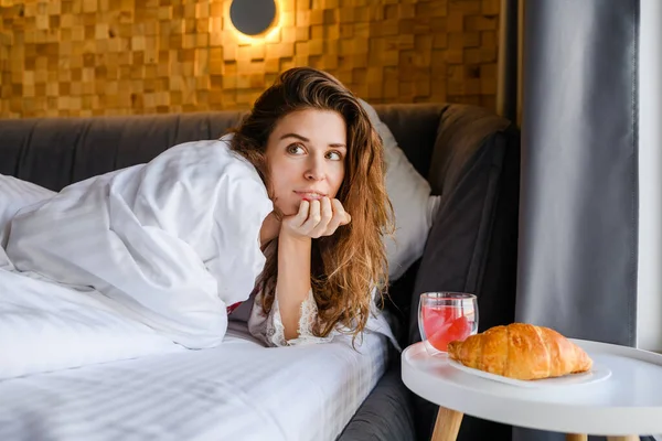 stock image Attractive young woman having breakfast in bed in the morning