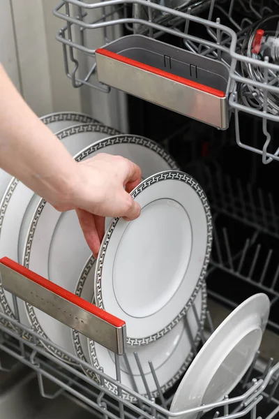 Female Hand Takes Out Clean Plate Dishwasher Clean Dishes Dishwasher — Stok fotoğraf