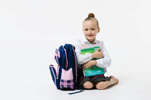 Year Old Girl School Uniform Smiles While Hugging Book Her — Stock Photo, Image