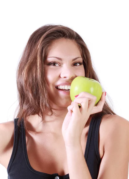 Beautiful happy girl bites fresh green apple isolated on white b — Stock Photo, Image