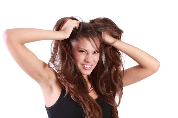 Joven mujer enojada rasga su cabello y mira a la cámara aislada en — Foto de Stock