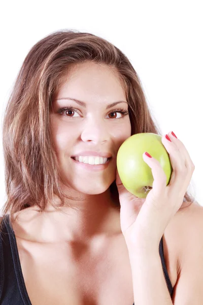 Beautiful smiling girl shows fresh green apple isolated on white — Stock Photo, Image