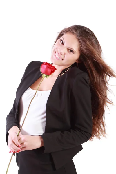 Lachende vrouw met vliegende haren bevat rode roos geïsoleerd op wit — Stockfoto