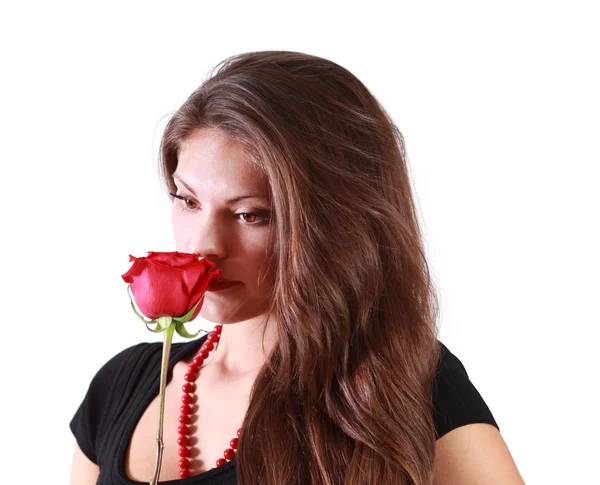 Pensive beautiful woman sniffs red rose isolated on white backgr — Stock Photo, Image