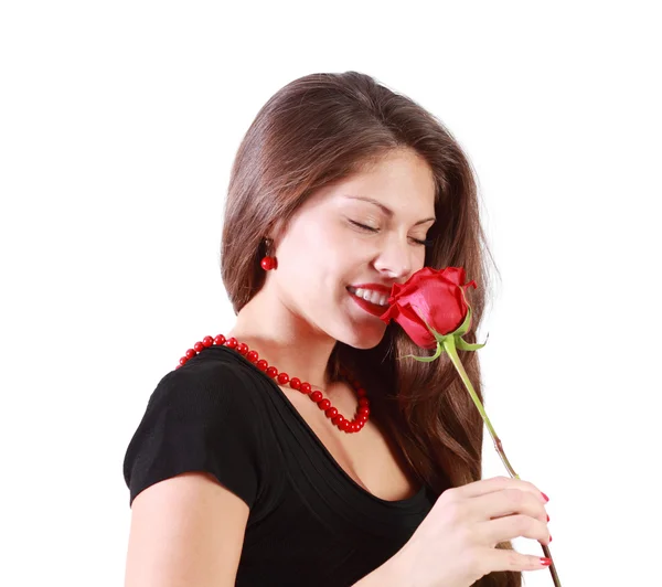 Smiling beautiful woman with closed eyes sniffs red rose isolate Stock Image