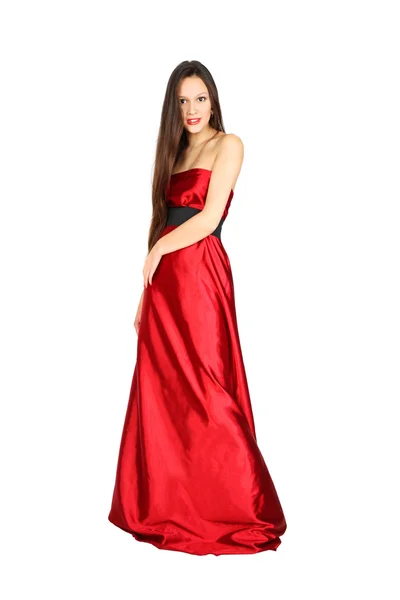 Menina bonita vestindo vestido vermelho longo fica isolado no branco b — Fotografia de Stock