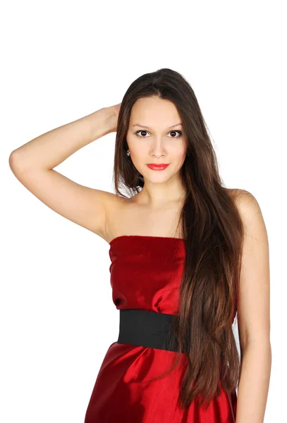 Young girl wearing red dress touches to hair isolated on white b — Stock Photo, Image