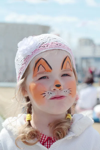 Little beautiful girl with face painting of orange fox at sunny — Stock Photo, Image