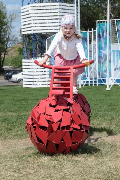 PERM, RUSSIA - JUN 13, 2013: Girl on bike with spherical wheels — Stock Photo, Image