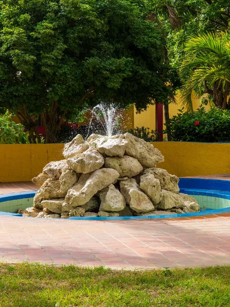 Relaxing resort water fountain made from large boulders — 스톡 사진
