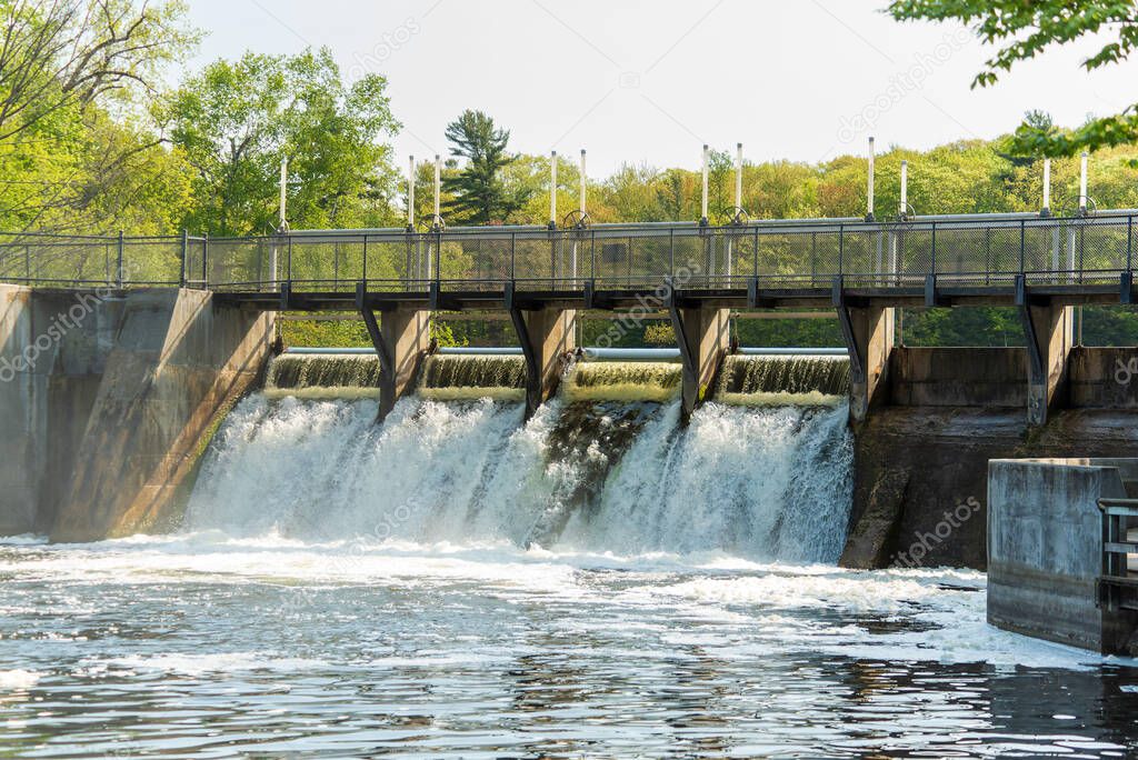 Water flowing through the Hamlin Lake Dam in Ludington Michigan. High quality photo