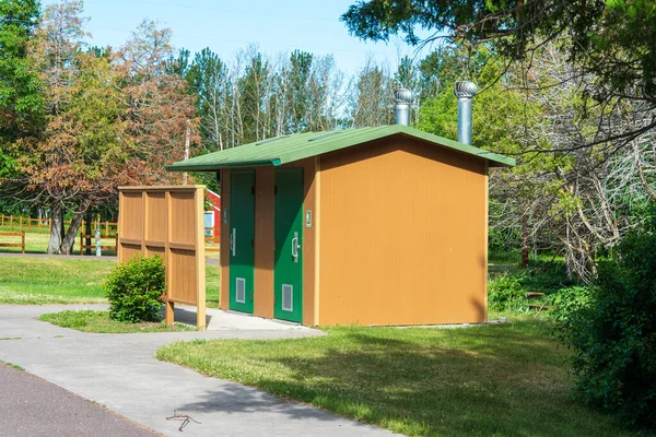 Rural public restroom facility located at a roadside park. High quality photo