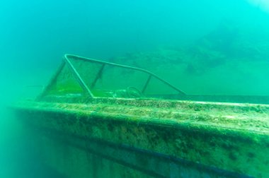 Wreck of recreational speed boat scuttled in a quarry now used as a scuba diving site.