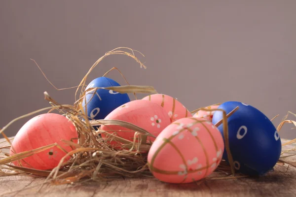 Easter colored eggs on woden background — Stock Photo, Image