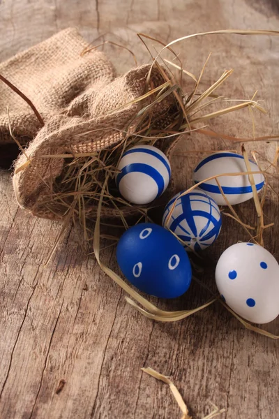 Easter colored eggs on woden background — Stock Photo, Image