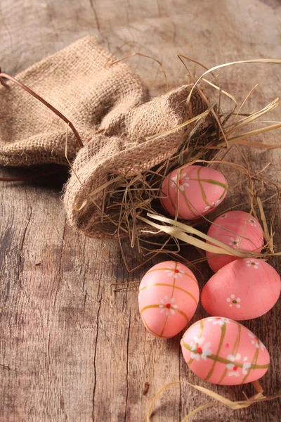 Easter colored eggs on woden background — Stock Photo, Image