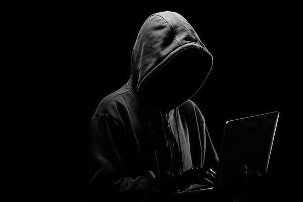 Hacker Is Trying to hack Data From The server Side On the laptop with hoodie