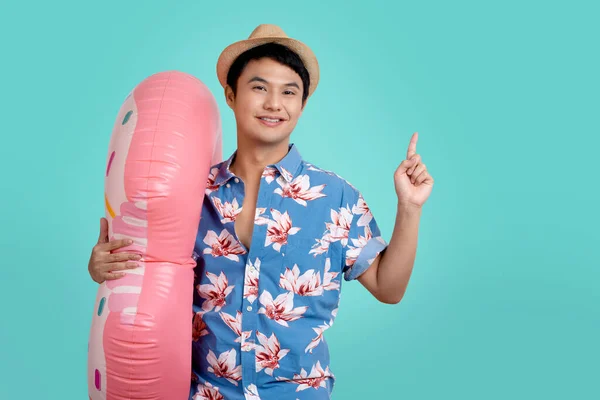 Young Asian Tourist Wearing Hat Holds Inflatable Ring Points His — ストック写真