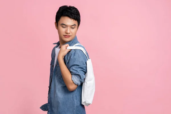 Handsome Asian Man Wearing Casual Clothes Holding White Cloth Bag — Foto de Stock