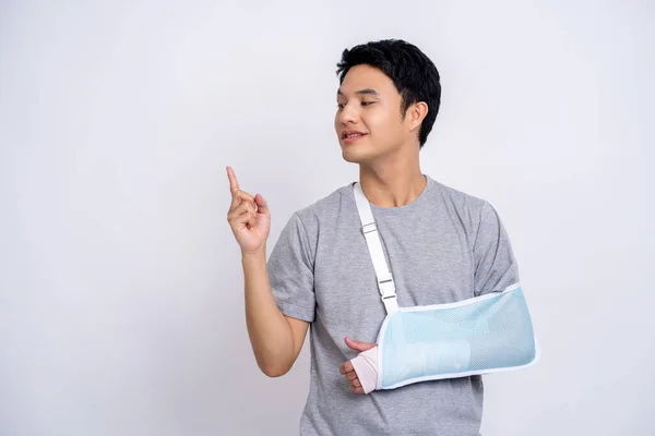 Handsome Asian Man Broken Hand Isolated White Background Showing Copy — Stock Photo, Image