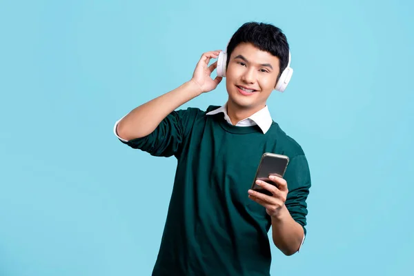 Happy Smiling Asian Man Green Casual Shirt Wearing Wireless Headphones — Stockfoto