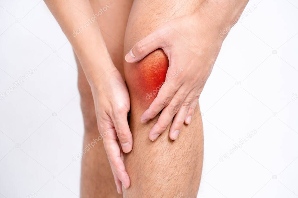 Close-up of Asian men with knee and leg pain By using hands to massage body to relieve pain, Red spots with pain.