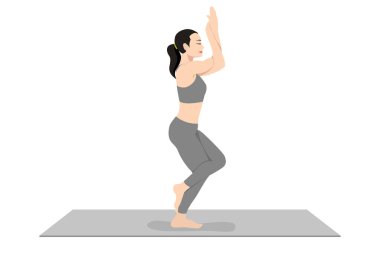 Kartal Pozu, güzel kız Garudasana antrenmanı genç çekici kadın yoga egzersizi yapıyor. Spor giyinmiş, spor giyinmiş, gri pantolonlu, üstsüz, uzun boylu, sakin ve rahat..