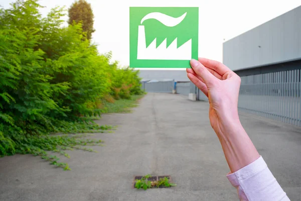 Hand holds green idustry symbol — Stock Photo, Image