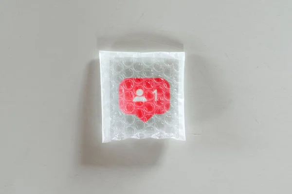 Packaging social Follower icon with bubble wrap — Fotografia de Stock