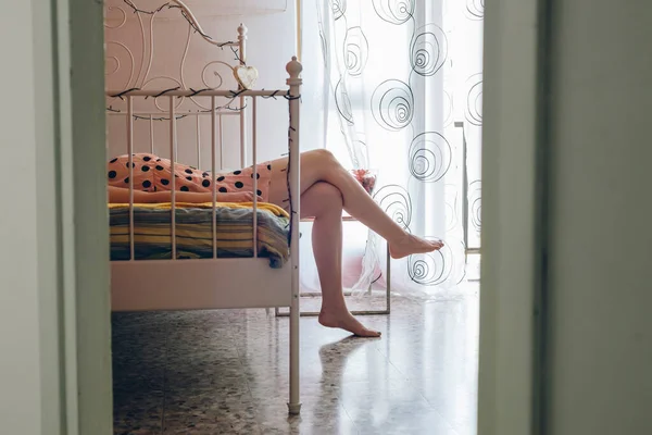 Young Woman Relaxing Bed Wearing Polka Dot Dress — Foto Stock