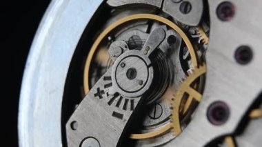 Clockwork. Clock. Macro shot of clock mechanism. Gears. Artistic blur