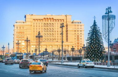 Four Seasons Hotel on Manezhnaya Square in Moscow and cars on Mokhovaya