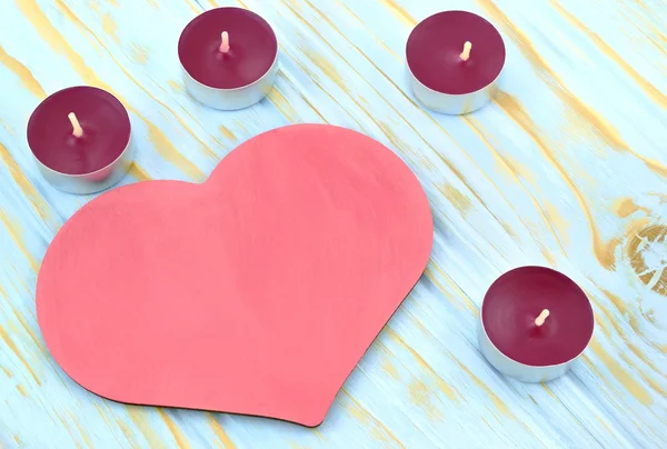Heart and candles on blue background — Stock Photo, Image