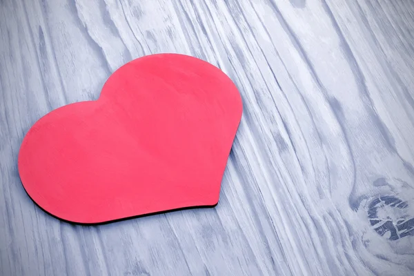 Pink heart on the background tinted wooden planks — Stock Photo, Image