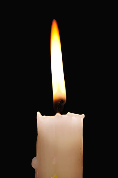 Tiché svíčku zapálil na tmavém pozadí Royalty Free Stock Fotografie