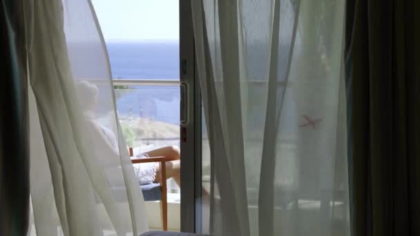 Young Woman Sits Balcony Hotel Enjoys Beautiful View Sea Palm — Stock Video