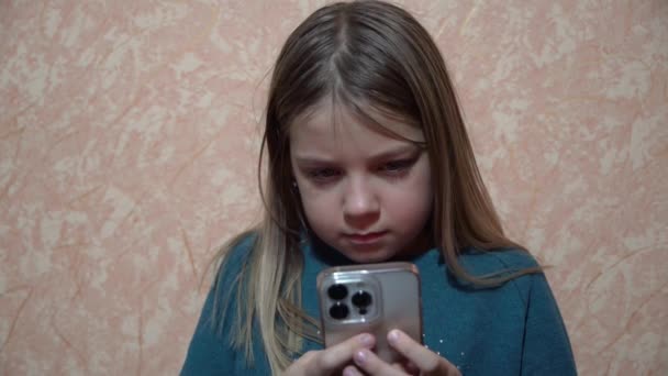 Blonde Young Girl Holds Iphone Her Hands She Enthusiastically Taps — Video Stock
