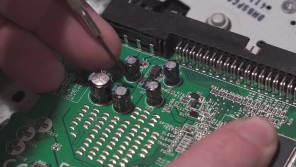 Consumer Electronics Repairman Makes Inspection Check Digital Circuit Board Close — Video Stock