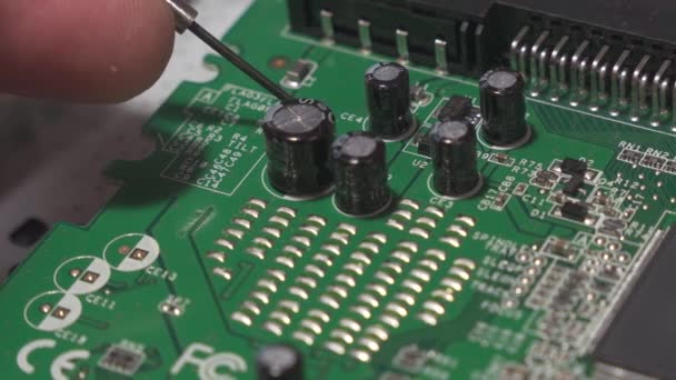 Consumer Electronics Repairman Makes Inspection Check Digital Circuit Board Close — стоковое видео