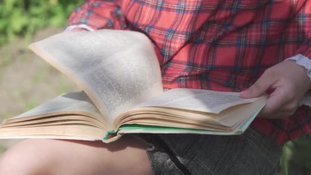 Schoolgirl Girl Holds Textbook Her Hands Reads Something Carefully Preparing — стоковое видео