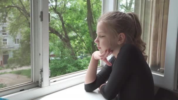 Sad Nine Year Old Girl Looks Out Window Balcony Her — Stock Video