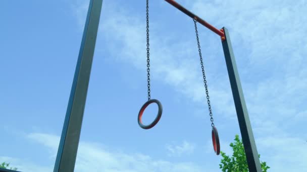 Empty Gymnastic Rings Hanging Courtyard Sports Ground Sky Concept Playing — Vídeo de Stock