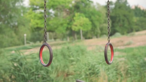 Gymnastic Rings Made Metal Courtyard Sports Ground Swing Different Directions — Stockvideo